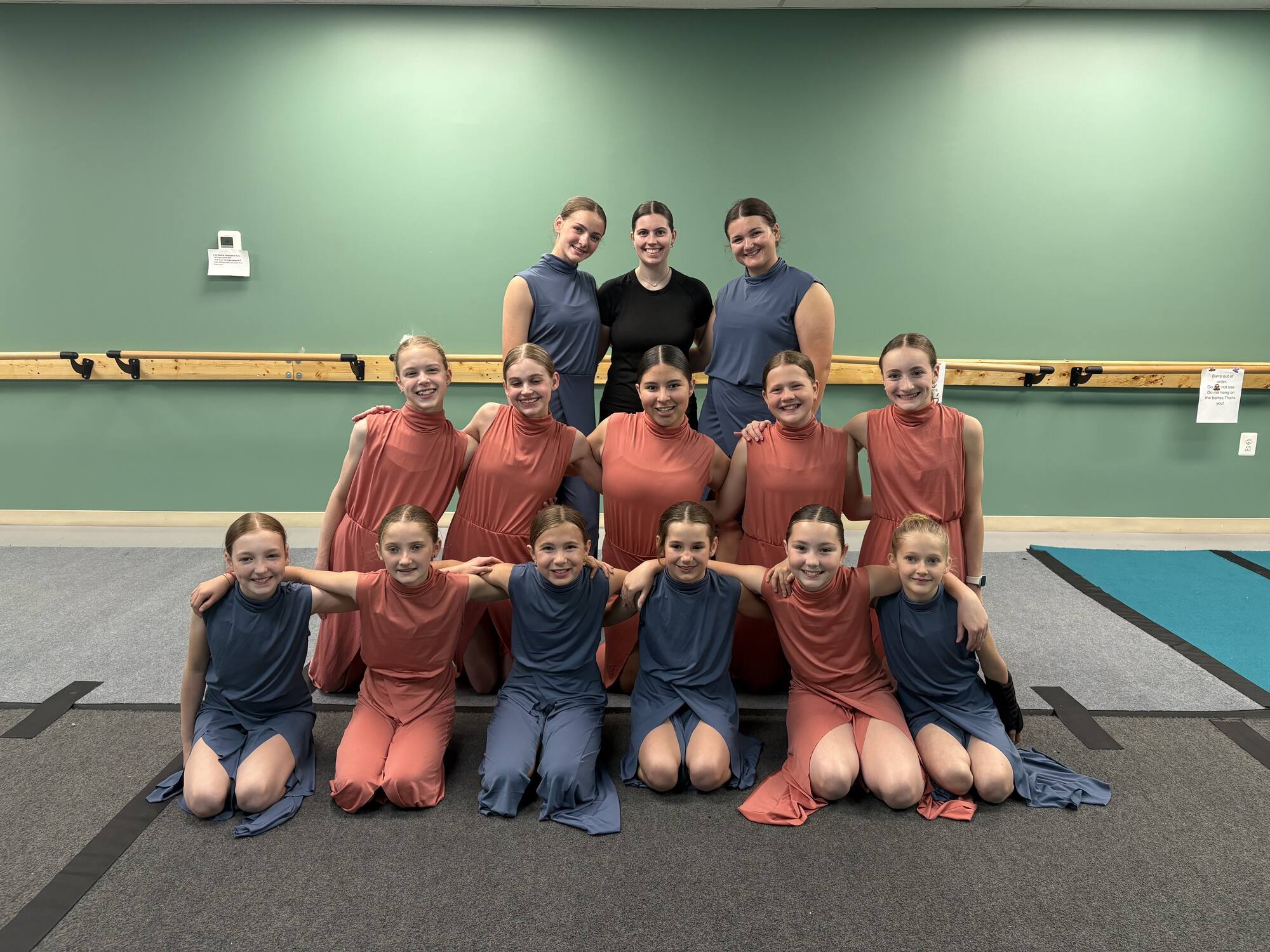 A class group with their teachers inside the Reverence studio